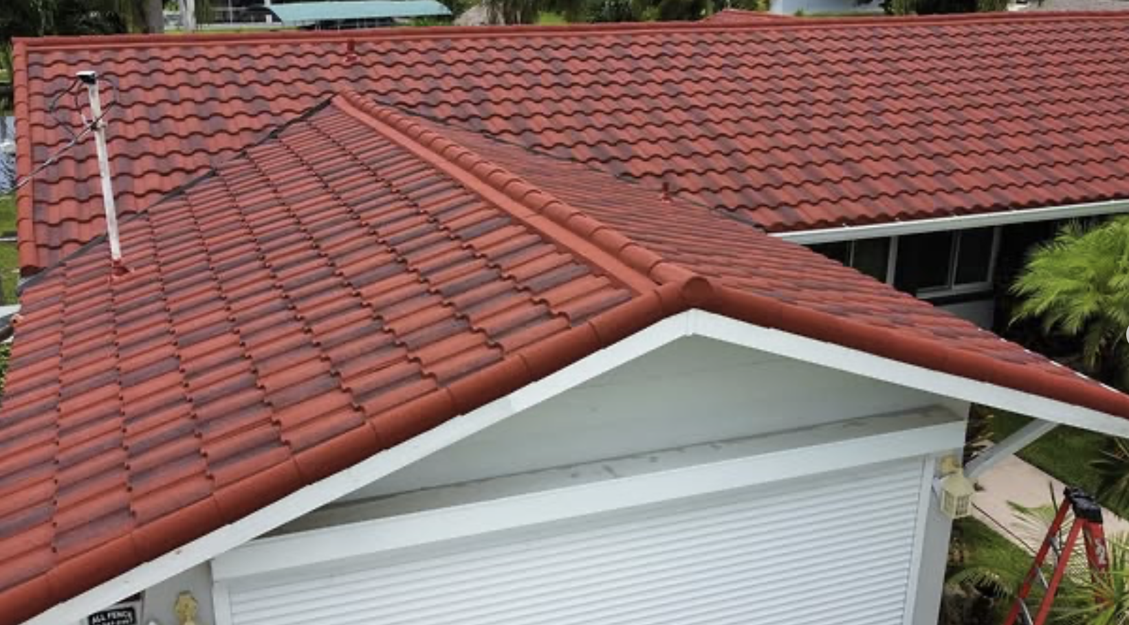 D' Roofing crew completing a clean re-roof on a Naples home